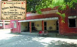 A view of the Red Cross Jagat Parkash Sarai building on the premises of the Civil Hospital in Bathinda. Inset is the foundation stone of the Sarai laid in 1981 by the then DC S. Jai Singh Gill