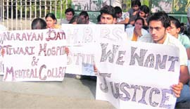 Students hold a protest at the Gandhi Park in Dehradun on Tuesday.