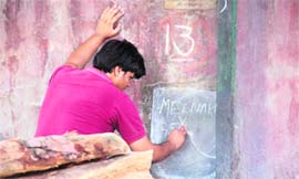 Harish, brother of deceased Meenakshi Sethi,performs rituals at the Jogi Gate cremation ground in Jammu on Tuesday.