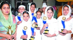 Winning students of Swami Sant Dass Public School pose with their trophies in Jalandhar.