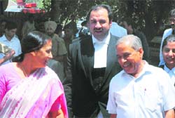 Anand Prakash, his wife Madhu and advocate Pankaj Bhardwaj at the district courts.
