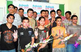 Students of Akash Institute who have passed the IIT entrance test in Dehradun on Wednesday