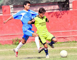 A match in progress at the Narendra Singh Kharola Memorial Football Tournament in Dehradun on Wednesday