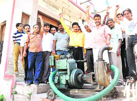 Protesters with a pump set which is used to draw water from the Ganga for cleaning purposes in Hridwar on Wednesday.