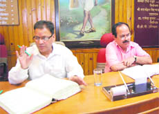 OP Uniyal (left) participates at the Nagar Palika Board meeting in Mussoorie on Tuesday.