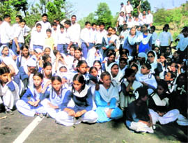 School students stage a protest in support of their demand for regular water supply near Reasi on Wednesday