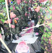 South Korean veterans beat an inflatable effigy of North Korean leader Kim Jong-il during an anti-North Korea rally in Incheon, west of Seoul, on Wednesday.