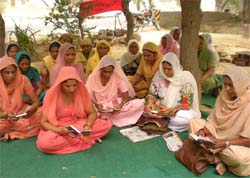 Anganwari workers recite paath of Sukhmani Sahib in Lambi on Thursday.