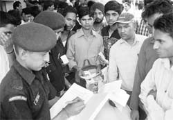 Armymen complete the formalities for youngsters who were interested in joining the Army during the job fest at MIA Bhawan, Phase VII, Mohali, on Thursday.