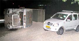 Gravels strewn on a road after an overloaded truck overturned on Wednesday night at the roundabout connecting Sectors 31, 32, 30 and 29 in Chandigarh.