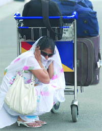 A woman shields herself from the scorching heat at Delhi airport on Thursday.