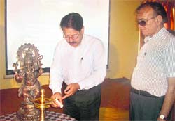 Principal Chief Conservator of Forests RBS Rawat lights a ceremonial lamp at a workshop in Mussoorie on Thursday.