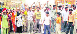 Residents hold a protest against the shortage of water in Sirsa on Thursday.