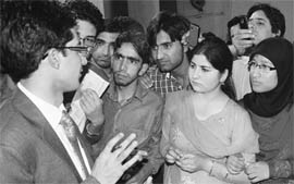 Civil Services Examination topper Dr Shah Faesal interacts with students of Burn Hall School in Srinagar on Thursday.