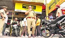 Cops at the spot where the robbery took place in Ludhiana on Thursday.