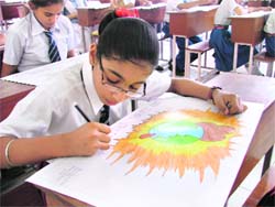 A student participating in a poster-making contest in Ludhiana on Thursday. 