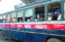 A school bus of the Punjab Police spotted with windowpanes missing in Amritsar.