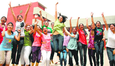 Students celebrate after the declaration of CBSE class X results at Sacred Heart School in Chandigarh on Friday. 
