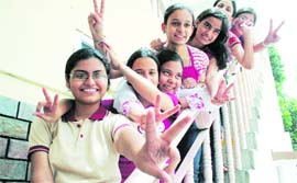 Students of Doon International School rejoice after the Class X CBSE results in Dehradun on Friday.