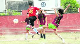 A match in progress at the Narendra Singh Kharola Memorial Football Tournament in Dehradun on Friday.