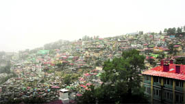 A hazy view of the hills after a duststorm hit Shimla on Friday