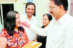 Annie Basson, who secured A-one grade, being felicitated by her father at Delhi Public School in Jammu
