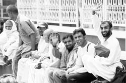 Nationals of Pakistan wait for the clearance of their documents at the Attari-Wagah joint checkpost on Friday.