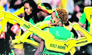 A supporter cheers for Jamaica's Usain Bolt at the mens 200 m event in the IAAF Diamond league athletics meet in Shanghai