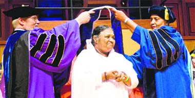 University at Buffalo President John B. Simpson (left) and State University of New York Trustee Eunice Lewin confer Mata Amritanandmayi with the honorary Doctorate of Humane Letters on May 25.