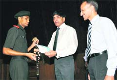 Lt General VK Ahluwalia, GOC-in-C, Central Command, presents an award to a cadet during the graduation ceremony of RIMC) in Dehradun on Saturday