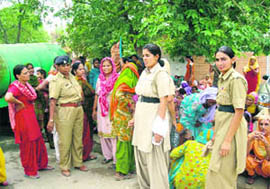Followers wait in the sun as dera chief Gurmeet Ram Rahim Singh appears in the court through videoconferencing in Sirsa on Saturday.