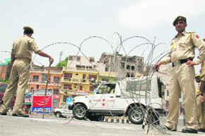 Barbed wires placed at the Gujjar Bridge to block the road for traffic due to the visit of UPA chairperson Sonia Gandhi in Jammu on Saturday. 