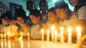 Schoolchildren in Amritsar pay homage on Saturday to the train passengers killed in West Bengal. 