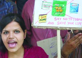 NO TOBACCO DAY TODAY: Members of the Indian Association of Professional Social Workers shout slogans during a demonstration against tobacco in New Delhi