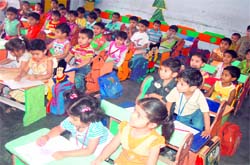 Tiny tots of primary schools take part in a drawing and calligraphy competition in Haridwar on Sunday.