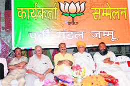 BJP leaders participate in a workers convention organised by the BJP East Mandal at Brahman Sabha, Parade, in Jammu on Sunday.