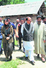 PDP president Mehbooba Mufti visits the house of one of the youths killed in an alleged fake encounter, in Baramulla district on Sunday.  PTI