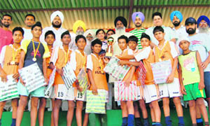 Players of Jarkhar Academy with their prizes after winning the first Olympian Prithipal Singh Six-a-Side Hockey League held at Jarkhar, near Ludhiana, on Sunday.