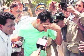 Jet Airways co-pilot Varun Agarwal, arrested on rape charge, being taken to a Mumbai court on Sunday. He was remanded in police custody.