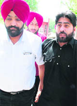 Dreaded terrorist Bakhshish Singh, arrested by the counter-intelligence wing of the Punjab police, is taken to court in Amritsar, on Sunday.