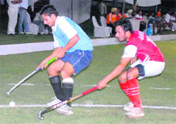 Players in action during a hockey match in Chandigarh on Monday
