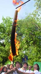 KICK THE BUTT: Students set on fire a 6-ft cigarette stick on World No Tobacco Day in New Delhi on Monday.