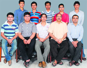 Students of Dutt and Verma Coaching Classes who have passed the AIEEE examination with their teachers in Dehradun on Monday.