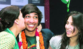 Arjun Vajpai, the youngest Indian to scale Mt Everest, gets a warm welcome at his home in Noida on Monday.  