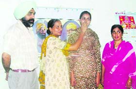 Dilpreet Kaur, who has made it to PSEB merit list, with her parents in Kharar