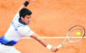 Novak Djokovic in action against Robby Ginepri