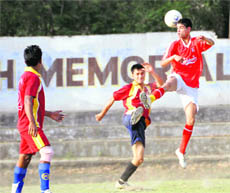   A match in progress at the Lala Nami Das District Football League on Tuesday. 