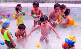 Schoolchildren at EURO Kids School enjoy a splash in a pool in Jalandhar.