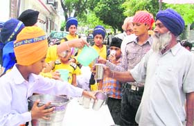As the mercury goes up, children offer chabeel to passersby in Ludhiana.