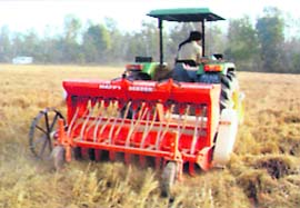 A happy seeder in use in a field.